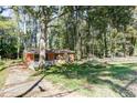 Quaint brick house with a spacious front yard and a driveway leading to the property at 4479 Richard Rd, Conley, GA 30288