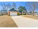 Lovely brick home with an attached garage and wide driveway, set on a well-maintained lot at 4184 Wyndham Park Cir, Decatur, GA 30034
