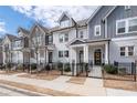 Attractive townhome row with black metal fences, well-kept lawns, and inviting front entrances at 2740 Bell Se Dr, Smyrna, GA 30080