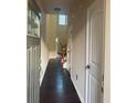 Bright hallway with hardwood floors and doors leading to various rooms at 2530 Gold Creek Ln # 100, Cumming, GA 30041