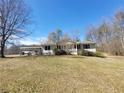 Cozy single-story home with a covered carport and a small porch surrounded by a grassy yard at 74 Sandy Path, Rockmart, GA 30153