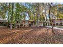 Charming single-story brick home with a covered carport and a beautiful tree-lined front yard at 2740 Pasco Se Ln, Atlanta, GA 30316