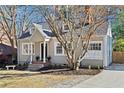 Quaint home with fresh landscaping, neutral color scheme, and a cozy front porch, perfect for enjoying the outdoors at 351 Delmont Ne Dr, Atlanta, GA 30305