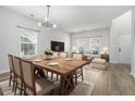 Bright dining area featuring a large wooden table and a view to the living room, perfect for gatherings at 2011 Farm Hill Ct, Stockbridge, GA 30281