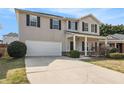 Charming two-story home with a well-manicured front yard and a two-car garage, perfect for a Gathering at 2011 Farm Hill Ct, Stockbridge, GA 30281