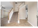 Open foyer featuring a carpeted staircase and tile flooring, providing a grand entrance at 2557 Tolliver Dr, Ellenwood, GA 30294