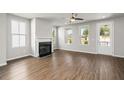 Bright living room featuring hardwood floors, fireplace, and ample natural light at 7 Hydrangea Unit 70 Way, Auburn, GA 30011