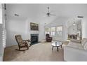 Cozy living room with fireplace, vaulted ceiling, and neutral color palette at 1905 Cottage Grove Way, Cumming, GA 30040
