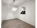 Dining area with hardwood floors and chandelier, adjacent to the kitchen at 400 17Th Street Nw # 1304, Atlanta, GA 30363