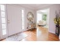 Bright and welcoming foyer with hardwood floors and stylish decor at 3500 Parkwood Hills Ct, Snellville, GA 30078