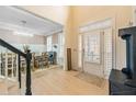 Inviting entryway with hardwood floors, shutters, and a view into the dining room at 650 Village Crest Dr, Suwanee, GA 30024
