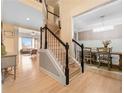 Spacious foyer with hardwood floors, staircase, and view into the dining room and living room at 650 Village Crest Dr, Suwanee, GA 30024