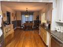 Open dining area with hardwood floors and a large table at 2820 Bluebird Cir, Duluth, GA 30096