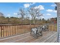 Relaxing outdoor deck area with chairs, perfect for enjoying the view at 210 Meadow View Dr, Grayson, GA 30017
