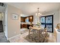 Bright dining area with wooden table, stylish chairs, and sliding glass doors for natural light at 11111 Shannon Cir, Hampton, GA 30228