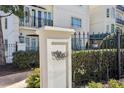 Exterior shot showcasing the building address with wrought iron fencing and professional landscaping at 3638 Peachtree Rd # 306, Atlanta, GA 30319