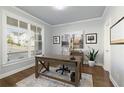 Bright office space with large windows, hardwood floors, and a comfortable workspace at 1760 Grand Oaks Drive, Woodstock, GA 30188