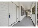 Close-up of the front porch with white railings and a stylish entrance at 2205 Dresden Nw Grn, Kennesaw, GA 30144