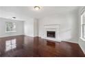 Spacious living room with hardwood floors and a fireplace feature at 2205 Dresden Nw Grn, Kennesaw, GA 30144