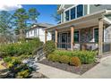Inviting porch with stone accents and manicured landscaping that adds curb appeal to the home at 3132 Skyland Ne Dr, Atlanta, GA 30341