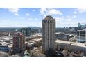 Expansive aerial perspective capturing the city skyline, modern architecture, and lush green landscapes at 3475 Oak Valley Ne Rd # 410, Atlanta, GA 30326