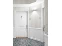 Clean hallway entrance featuring white doors, textured walls, and patterned flooring at 3475 Oak Valley Ne Rd # 410, Atlanta, GA 30326