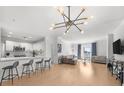 Open floor plan with modern lighting and a view to the city at 3475 Oak Valley Ne Rd # 410, Atlanta, GA 30326