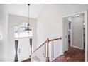 Bright foyer with hardwood floors, a chandelier, and natural light creating an inviting entry at 4046 Harvest Ridge Dr, Douglasville, GA 30135