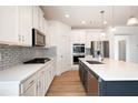 Modern kitchen features stainless steel appliances and white countertops at 505 Windy Ridge Ct, Canton, GA 30114