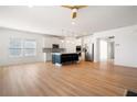 Bright, open-concept living space flows into a modern kitchen with a large island and stainless steel appliances at 505 Windy Ridge Ct, Canton, GA 30114