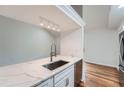 Modern kitchen with stainless steel sink, white marble countertop, and stainless steel appliances at 738 S Candler St, Decatur, GA 30030