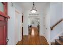 Bright foyer with hardwood floors and views into the living spaces of the home at 1337 Benteen Park Se Dr, Atlanta, GA 30315