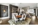 Sophisticated dining room with designer lighting, fireplace, and seating for eight at 210 Calypso Cir, Atlanta, GA 30305