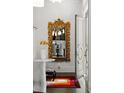 Elegant entryway with ornate mirror and stylish decor, creating a welcoming ambiance at 210 Calypso Cir, Atlanta, GA 30305