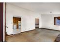View of the living room and kitchen showcasing open floor plan and natural light at 4223 Mountain Glen Trce, Snellville, GA 30039