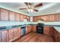 Well-lit kitchen with stainless steel appliances and hardwood flooring at 1276 Clay Sw Rd, Mableton, GA 30126