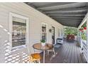 Inviting back porch with outdoor seating offers a relaxing space to enjoy the peaceful backyard at 3870 Wyntuck Nw Ct, Kennesaw, GA 30152