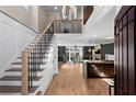 Open-concept living space featuring a staircase, hardwood floors, and abundant natural light at 1352 Middlesex Ne Ave, Atlanta, GA 30306