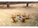Cozy backyard fire pit area featuring Adirondack chairs, perfect for gatherings and enjoying outdoor evenings at 4040 Merritt Dr, Cumming, GA 30041