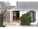 Charming front porch with wood decking and a well-maintained yard, perfect for entertaining at 4040 Merritt Dr, Cumming, GA 30041