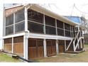 Spacious screened-in porch with convenient access to the backyard and ample room for outdoor relaxation and entertaining at 4040 Merritt Dr, Cumming, GA 30041
