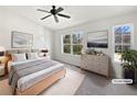 Bright bedroom with two windows, neutral décor, and modern furniture, virtually staged at 11403 S Grove Dr, Hampton, GA 30228