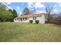 Well-maintained home featuring a spacious lawn and classic suburban architecture at 140 Wyonia Way, Fayetteville, GA 30215