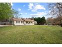 Spacious front yard with lush green grass surrounding a well-kept home at 140 Wyonia Way, Fayetteville, GA 30215