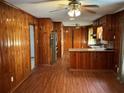 Open kitchen with wood cabinets and floors, featuring modern stainless steel appliances at 2374 Woodcastle Se Ln, Atlanta, GA 30316