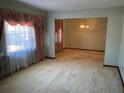 Light-filled living room with neutral walls and carpet, and large front window at 2374 Woodcastle Se Ln, Atlanta, GA 30316