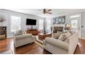 Inviting living room with a cozy fireplace, hardwood floors, and lots of natural light at 4160 Tilly Mill Rd, Atlanta, GA 30360