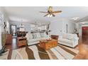 Spacious living room with hardwood floors and an open floor plan into the kitchen and dining area at 4160 Tilly Mill Rd, Atlanta, GA 30360