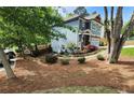 The home has a side yard with beautiful landscaping with lots of mature trees at 4160 Tilly Mill Rd, Atlanta, GA 30360