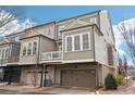 Rear exterior featuring garage access and a private balcony with stylish design at 4308 Southside Dr, Acworth, GA 30101